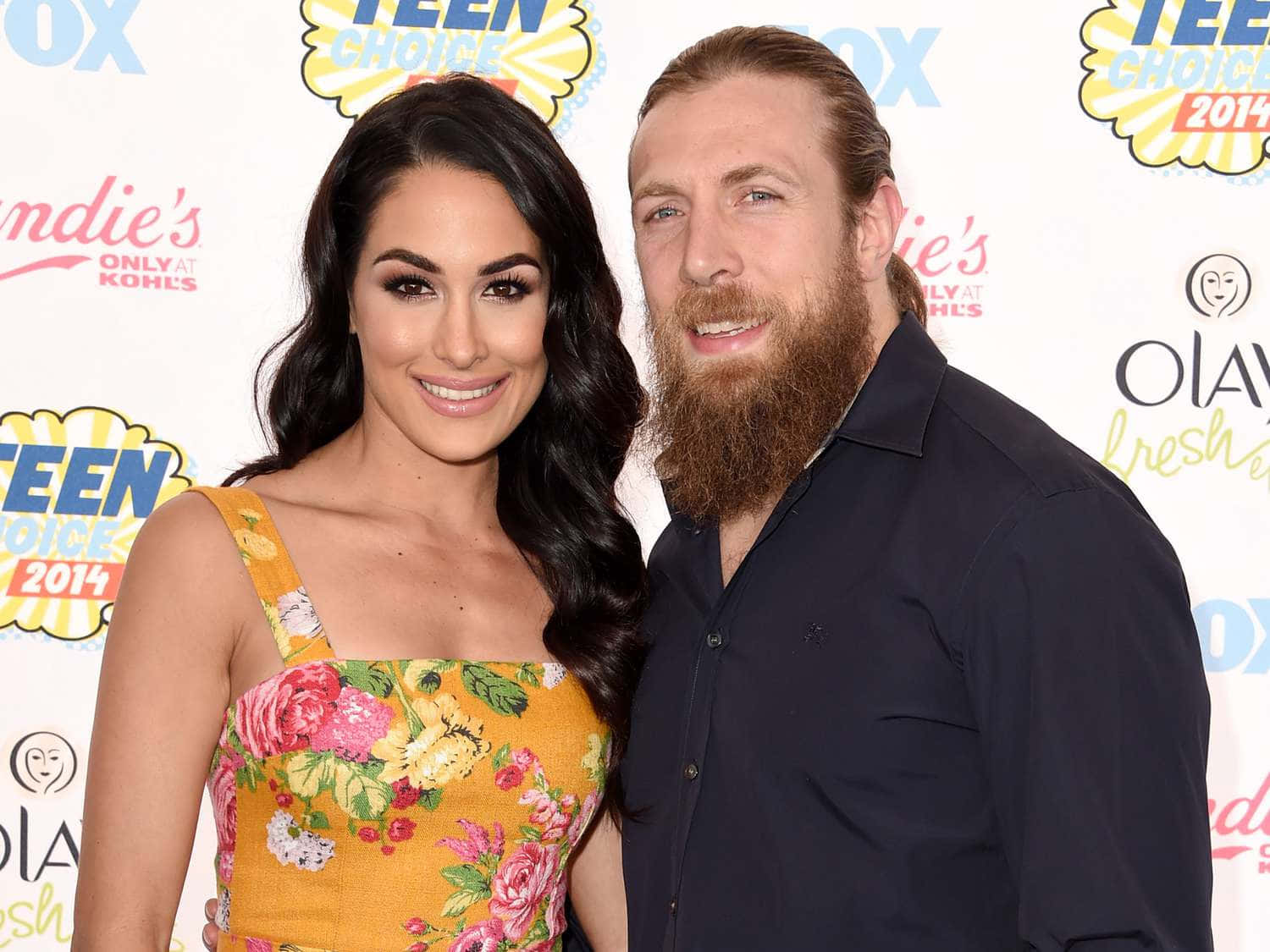 Bryan Danielson Brie Bella Wife Background