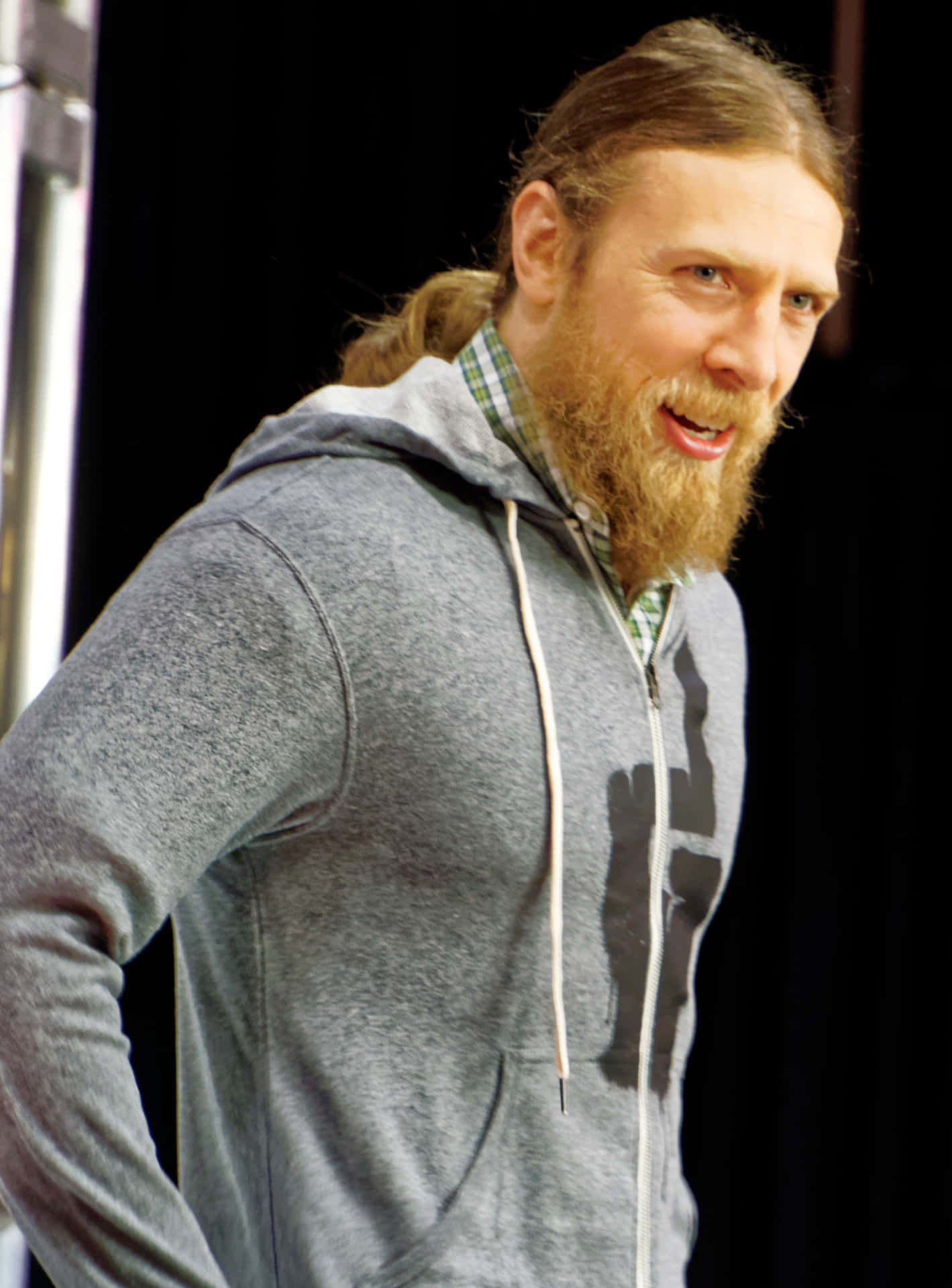 Bryan Danielson In Casual Attire Background
