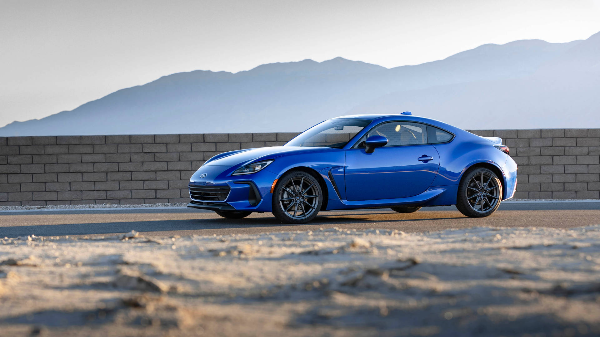 Brz Driving By A Wall Background