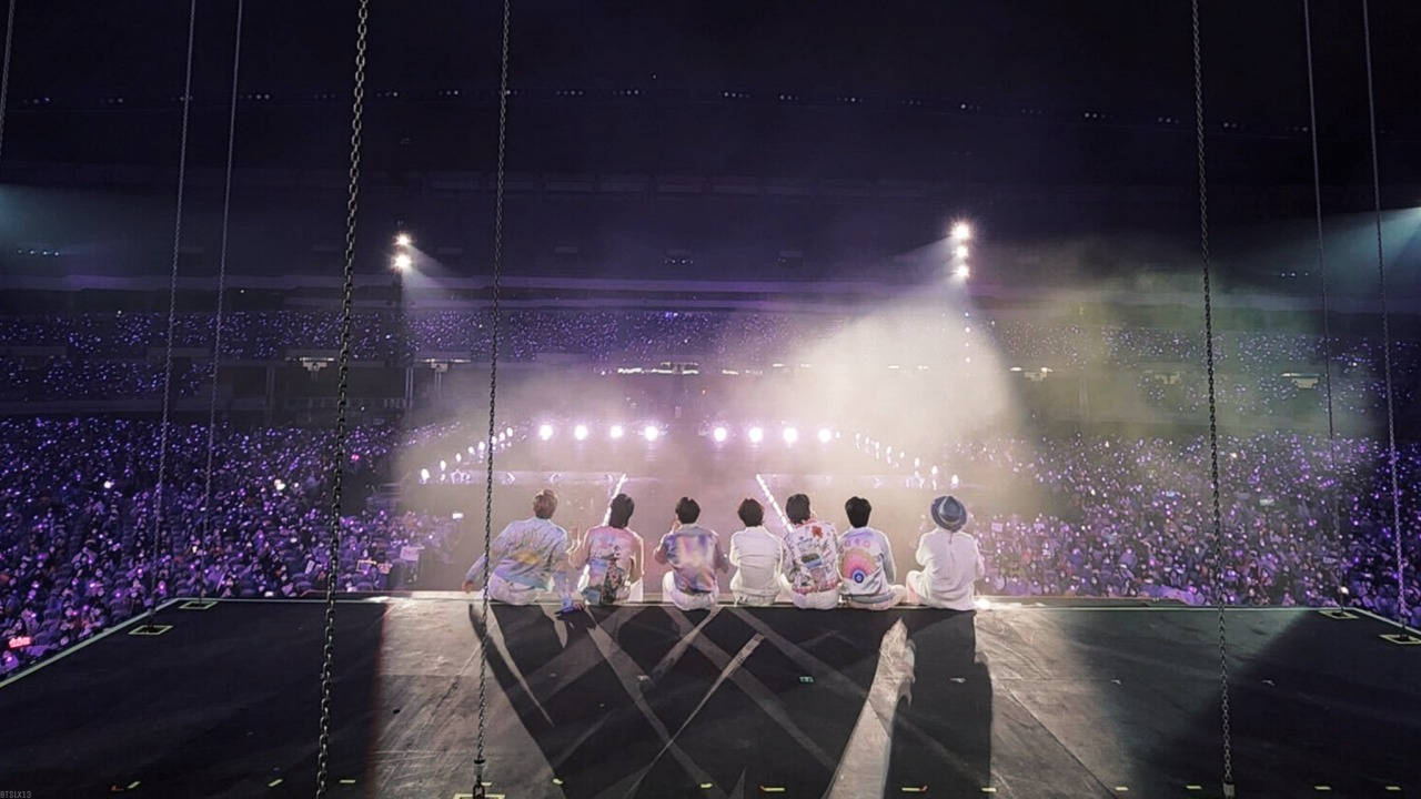 Bts Concert With Members On The Stage Background