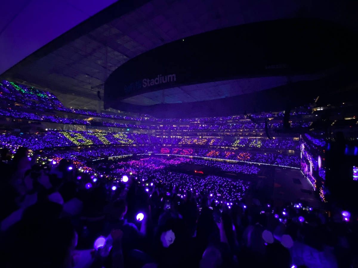 Bts Concert With The Purple Ocean Background
