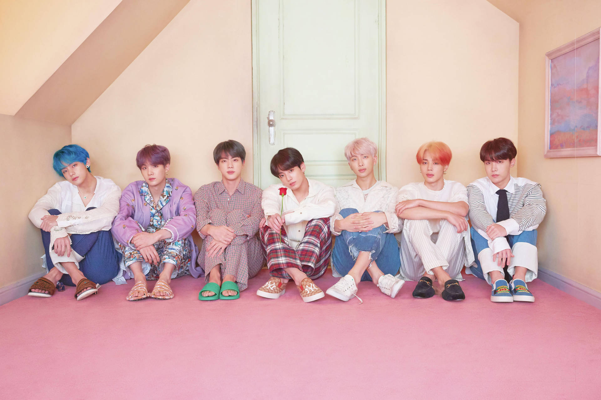 Bts Desktop Seated In Front Of Door Background