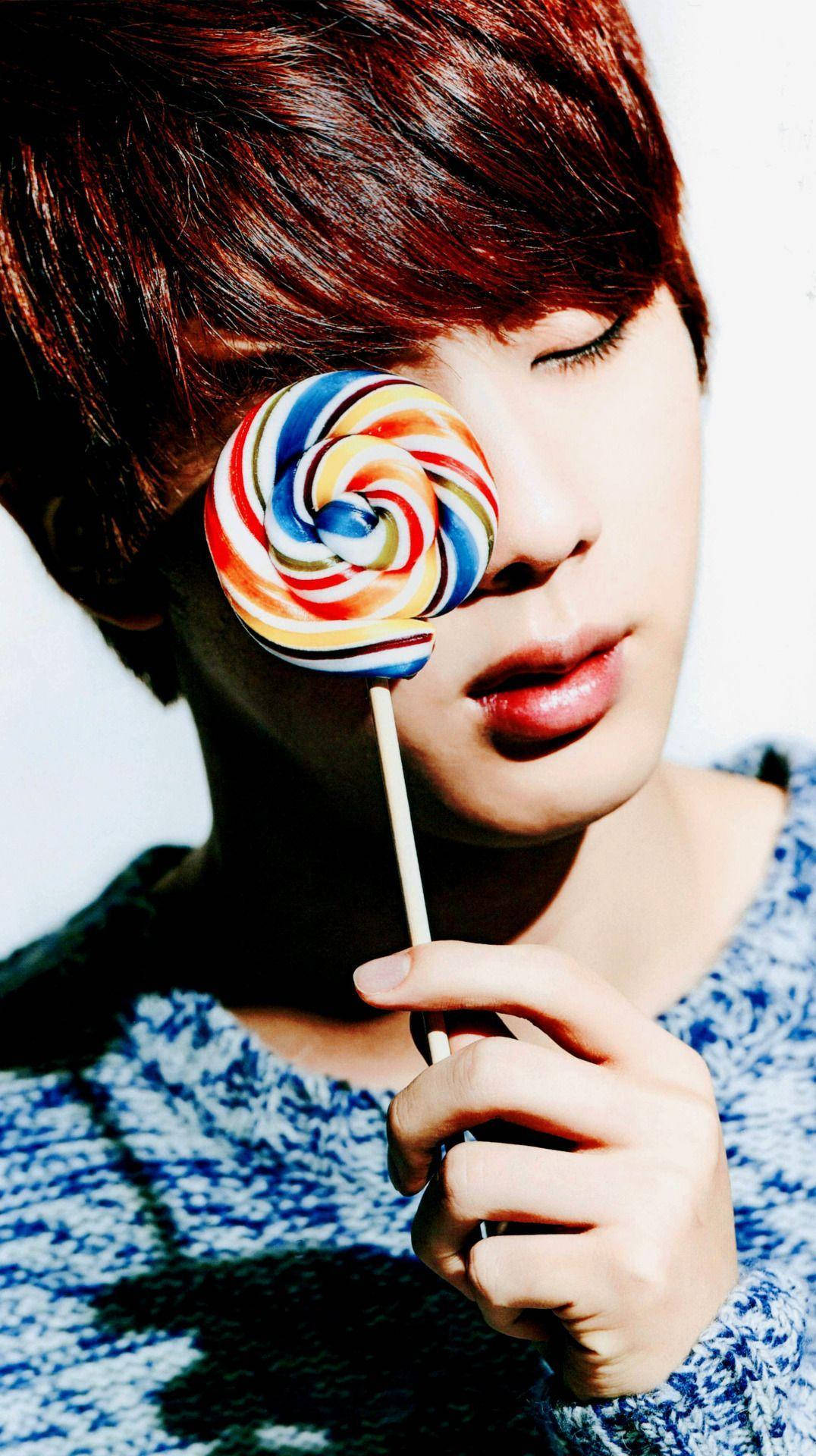 Bts Jin With Twirl Lollipop Background
