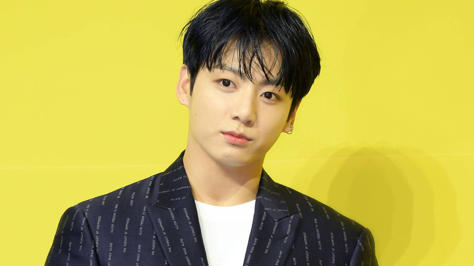 Bts Jung Kook On Yellow Backdrop Background