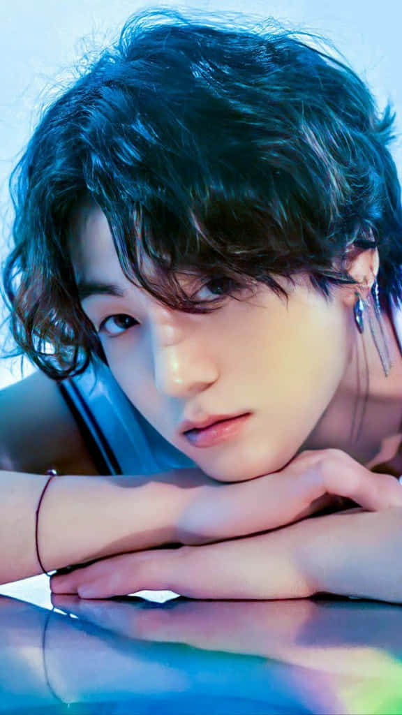 Bts' Jungkook Rocks Long Hair As He Strikes A Handsome Pose Background