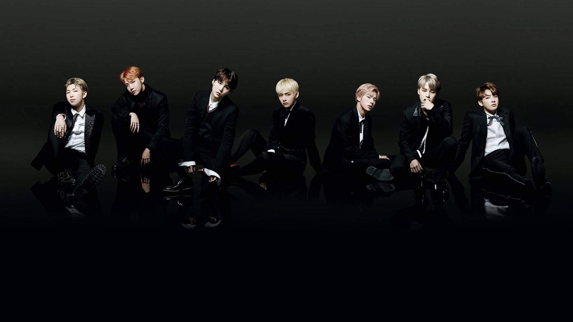Bts Members In Black On Black Floor Laptop Background