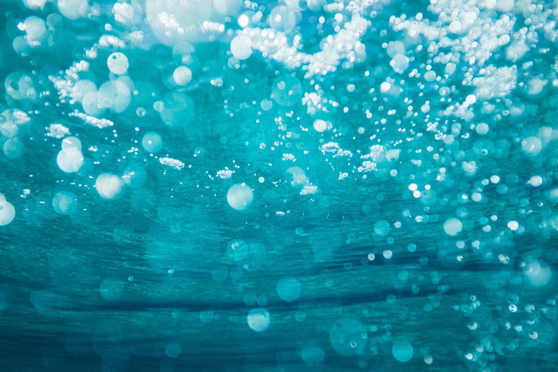 Bubbles In Ocean Blue Waters Background