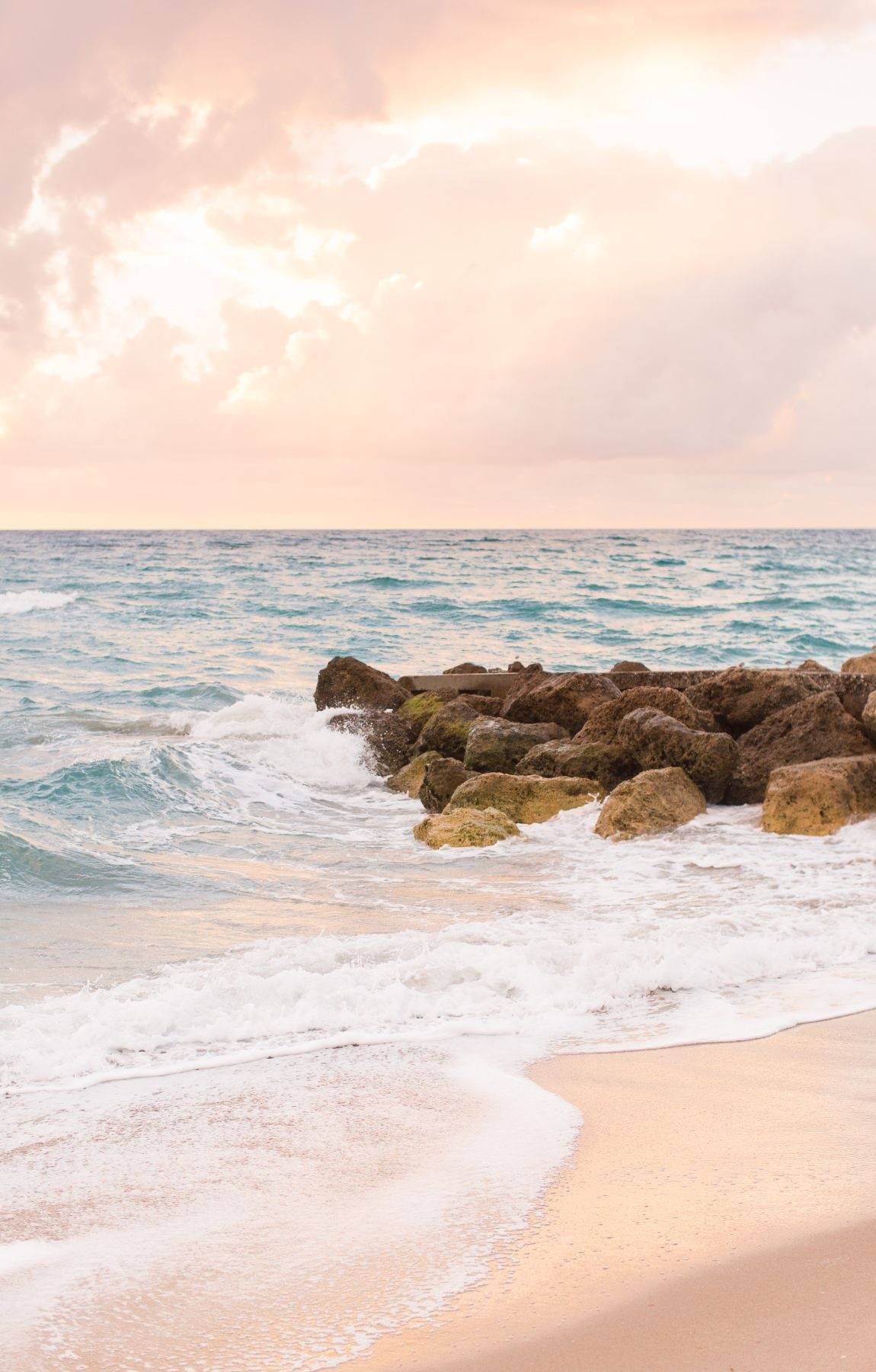 Bubbly Ocean Waves On Beach Sunrise Background