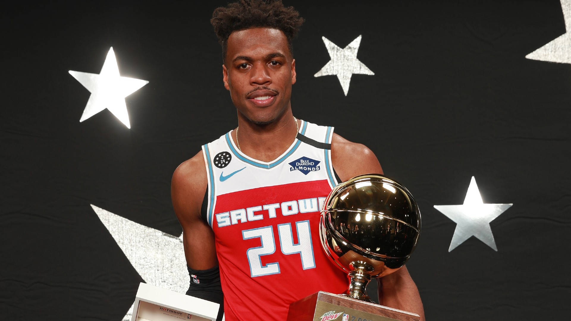 Buddy Hield With Trophy Portrait Background