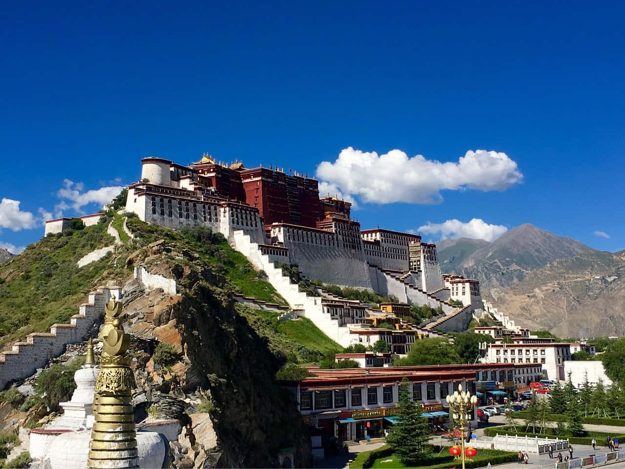Building In Lhasa Situated Above The Mountain Background