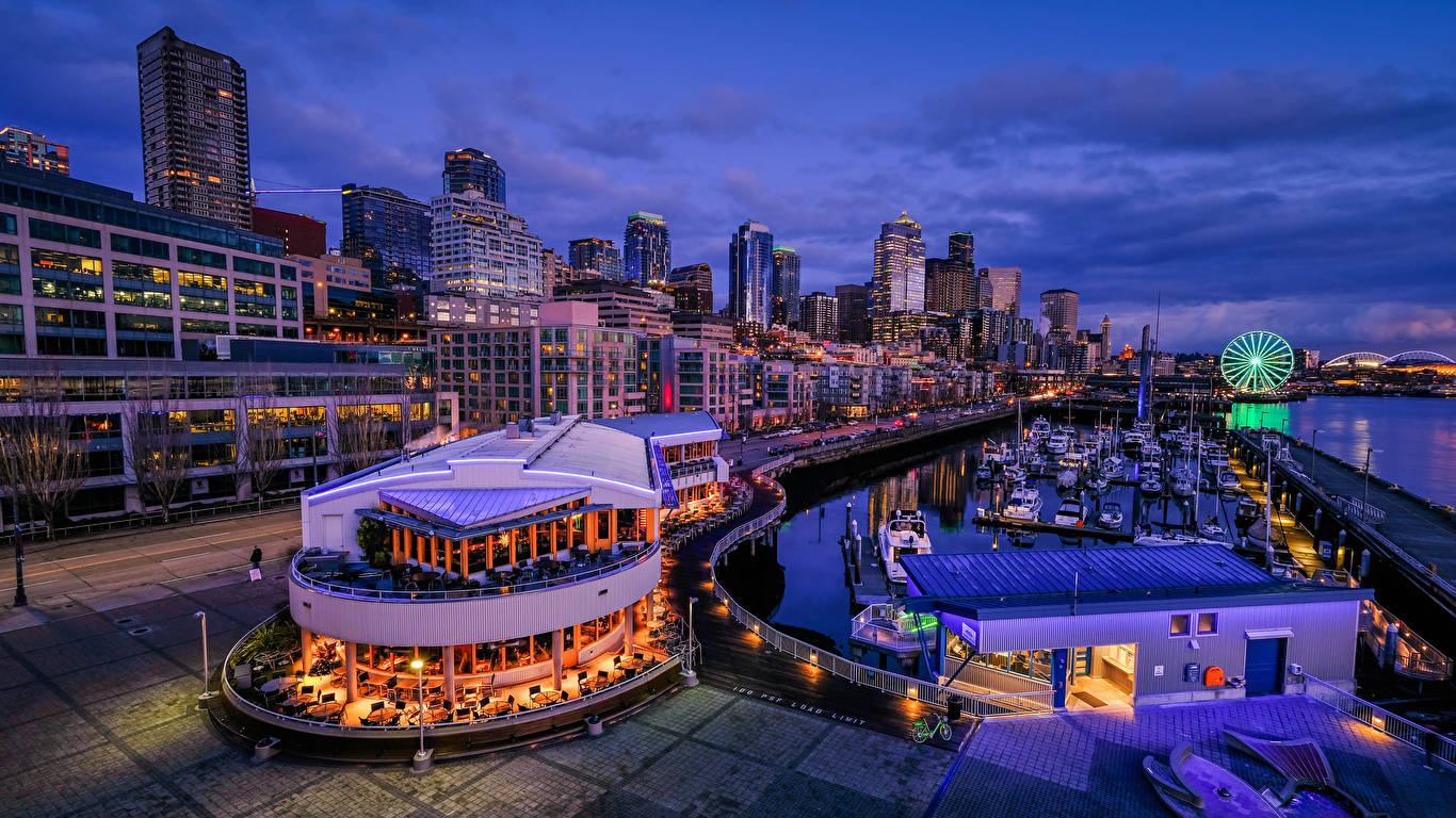 Buildings And Port In Seattle Background