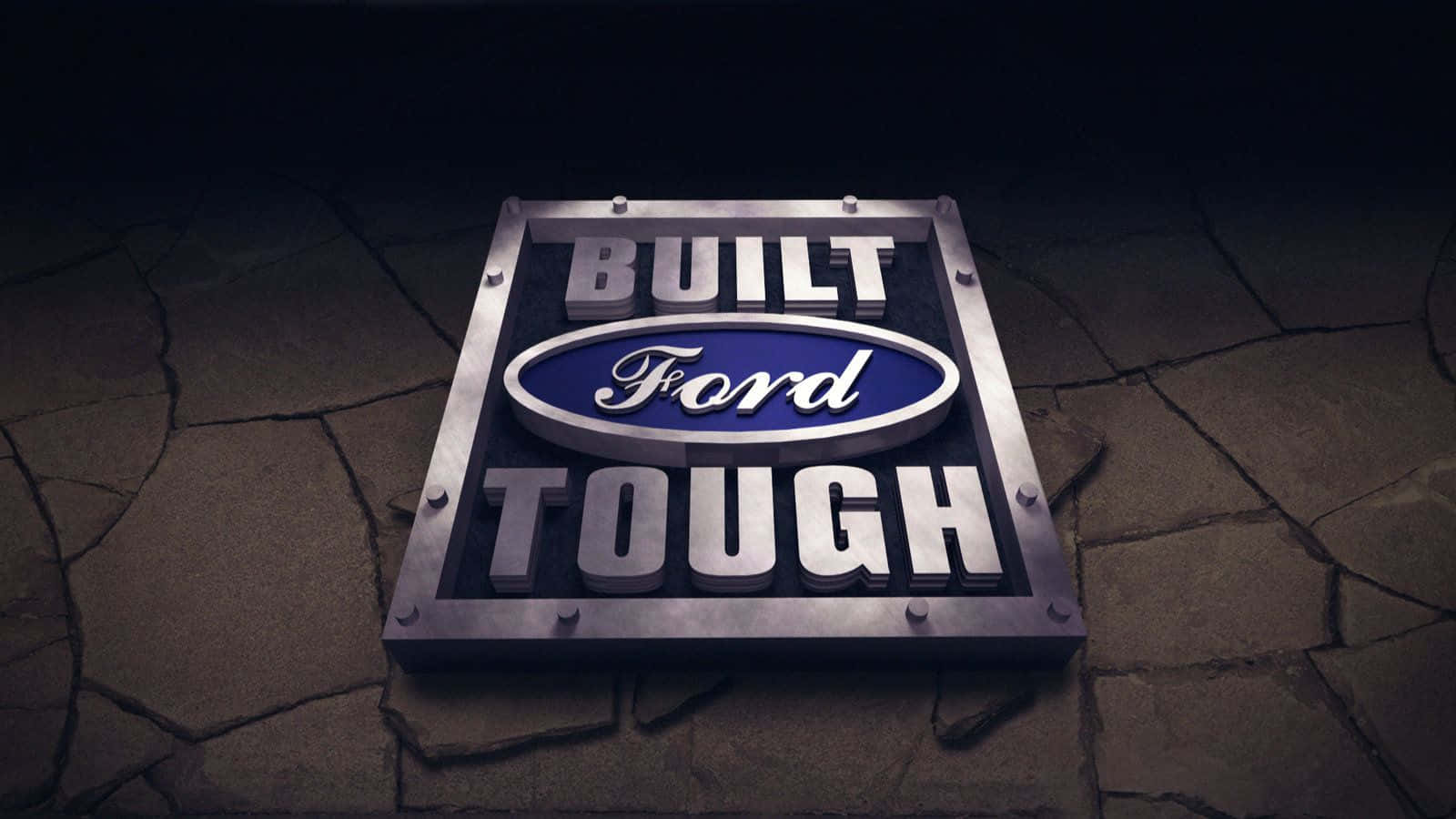 Built For Tough Logo On A Stone Wall