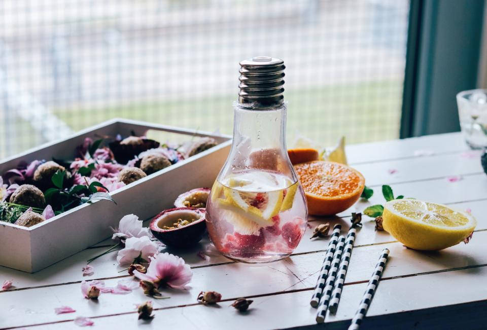 Bulb Bottle With Water And Fruits