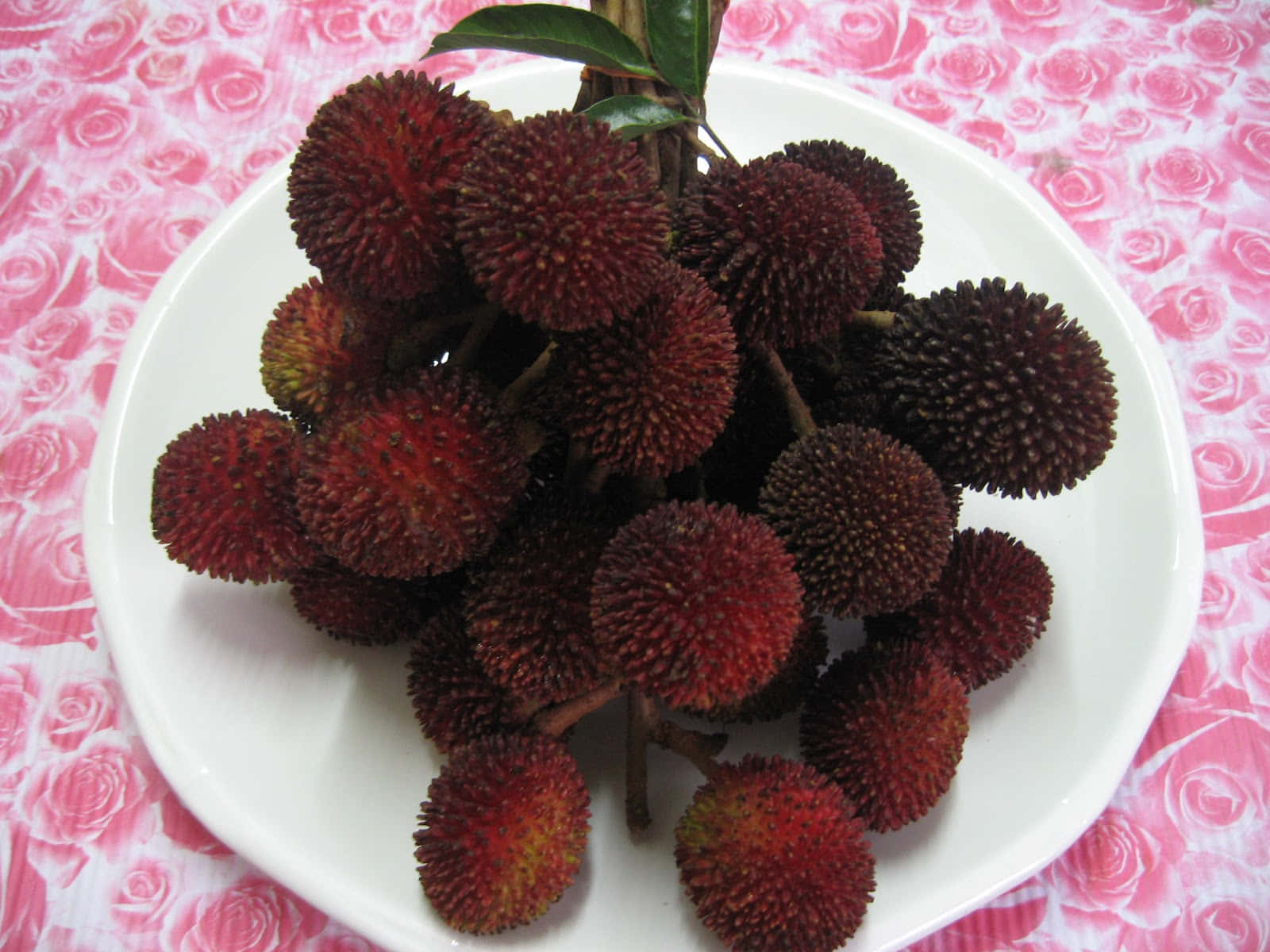 Bunch Of Pulasan Fruits On Plate