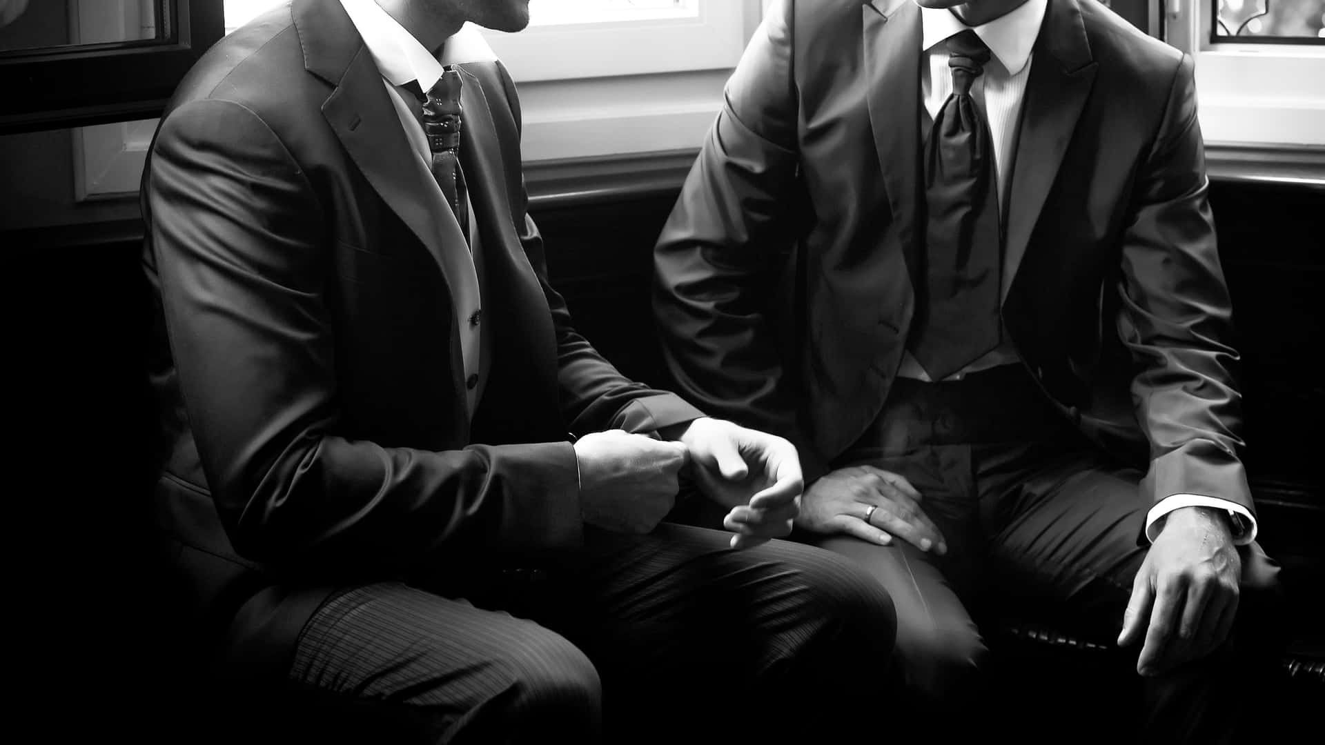 Business Men In Different Men Suit Styles Background