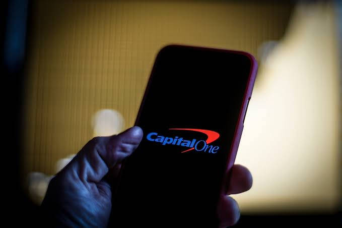 [business Person Using Capital One's Online Banking Service On Their Mobile Device] Background