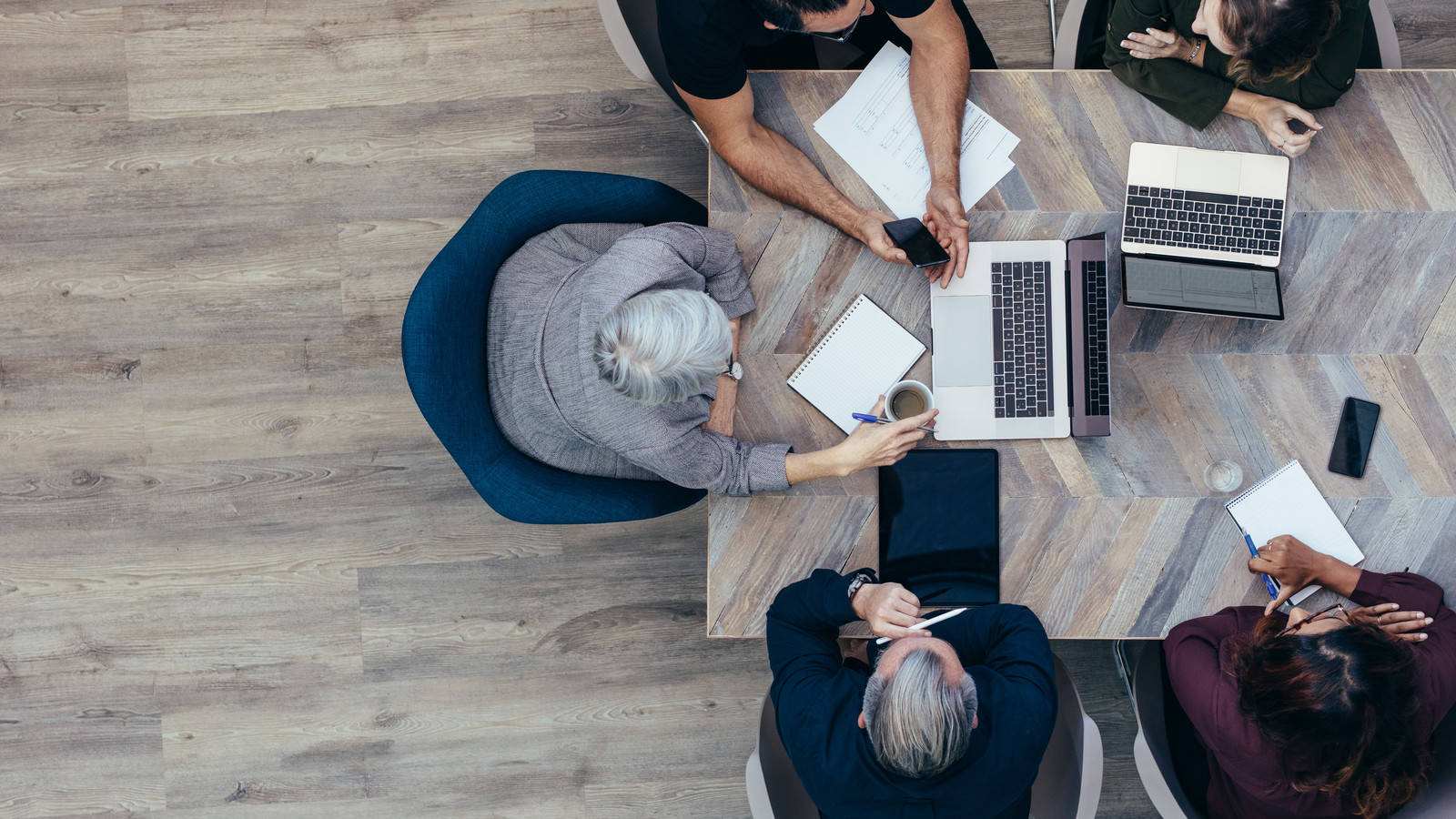 Business Team Working Together Aerial View.jpg Background