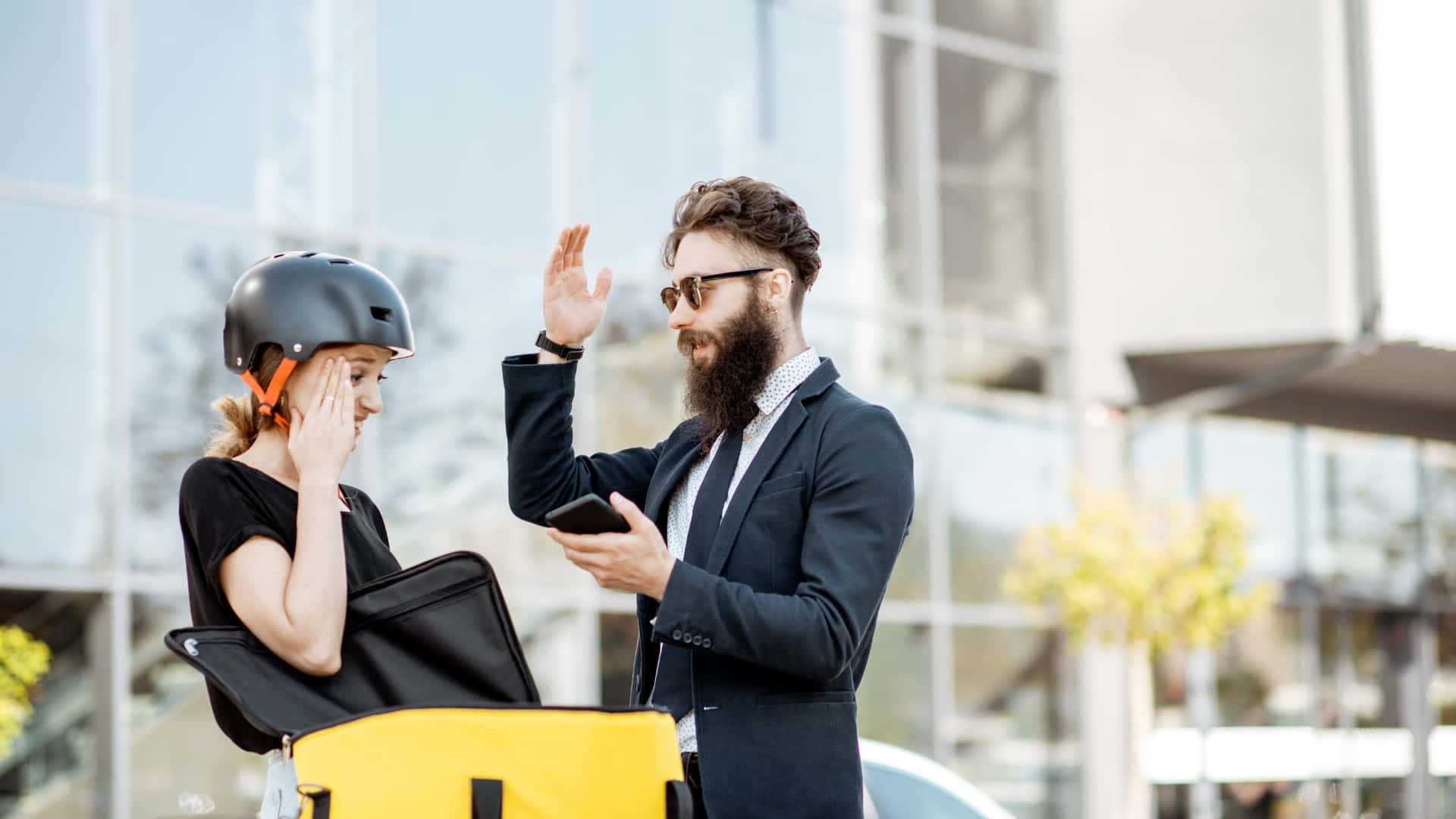 Businessmanand Delivery Girl Discussion Outdoors
