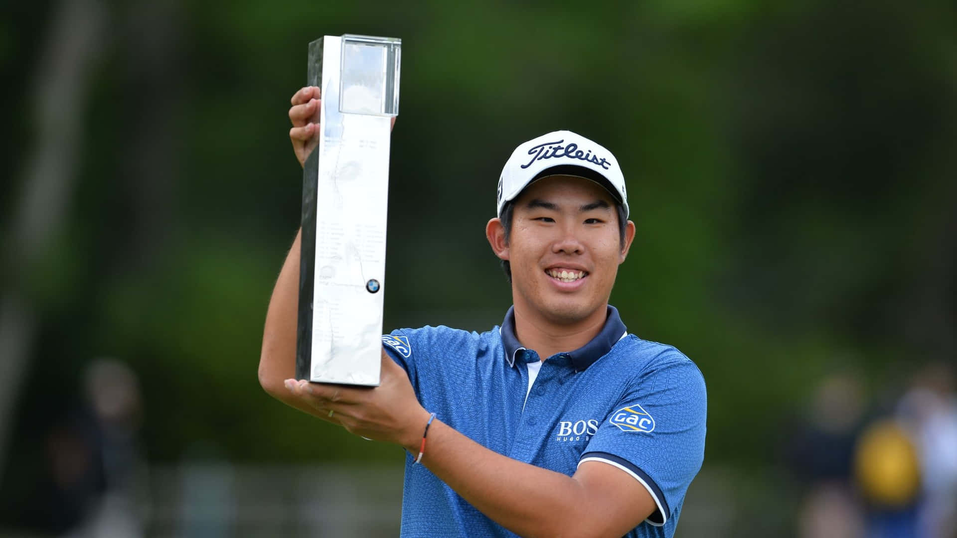 Byeong Hun An Raising His Trophy