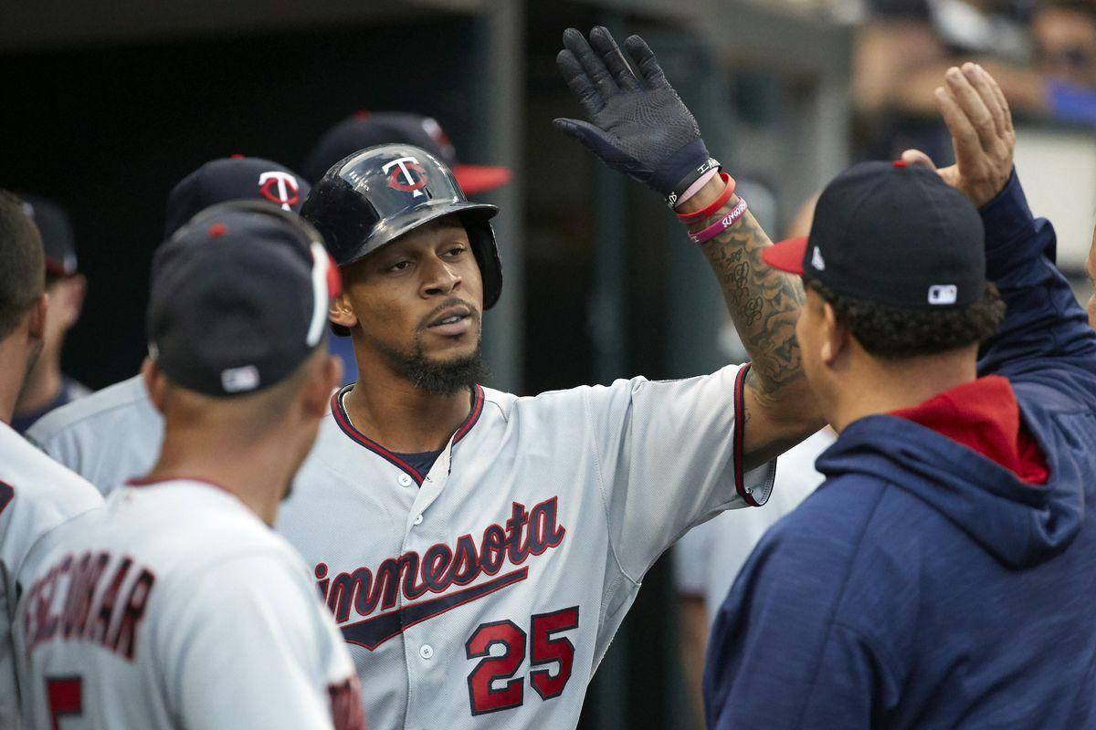 Byron Buxton High Five With Teammates Background