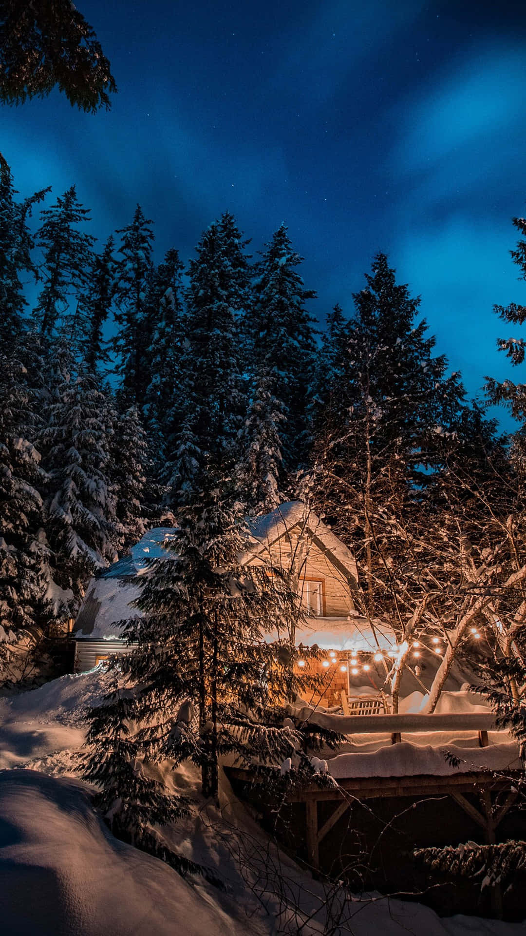 Cabin At Night With Snow Falling Background