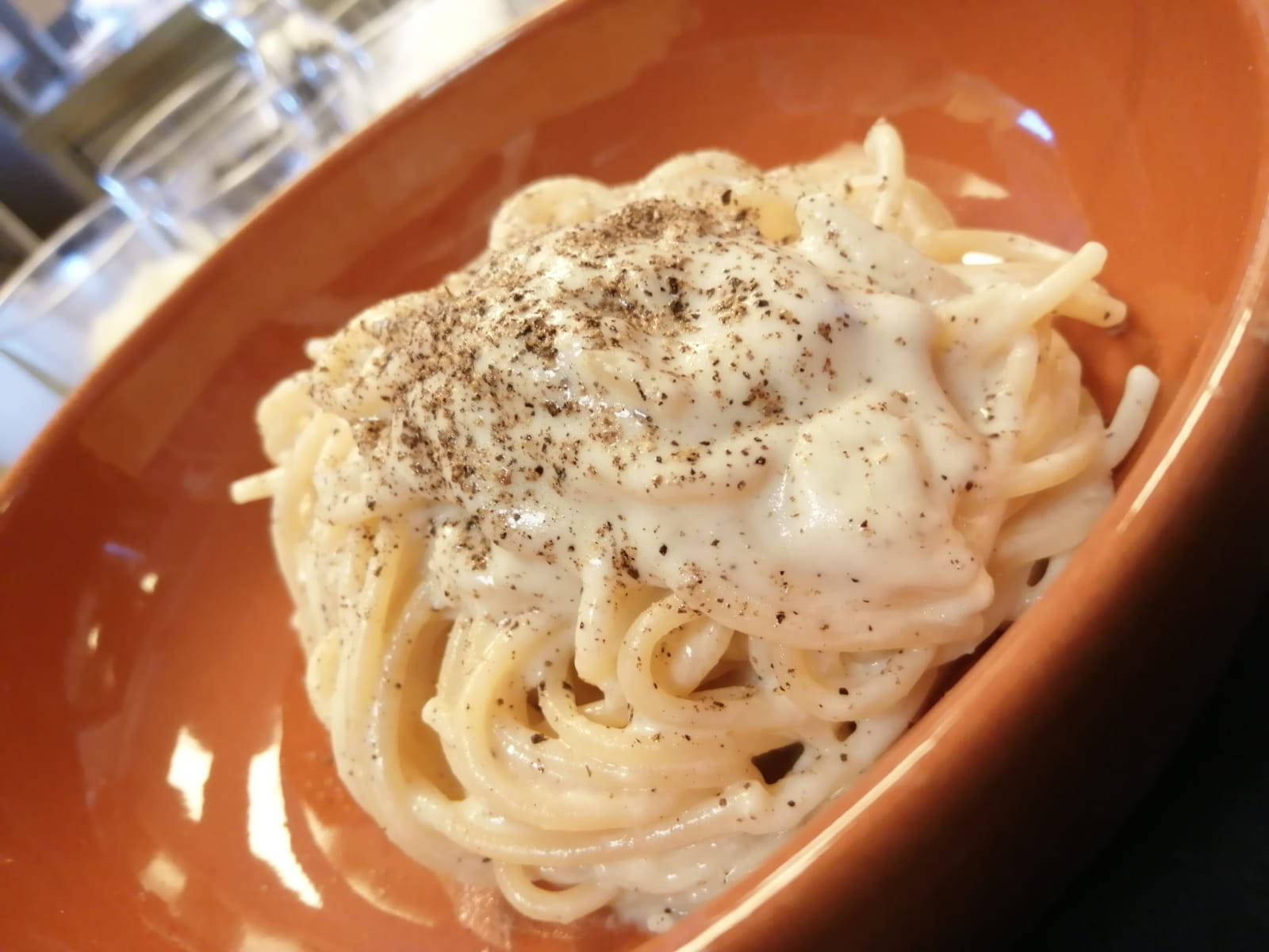 Cacio E Pepe On An Orange Plate