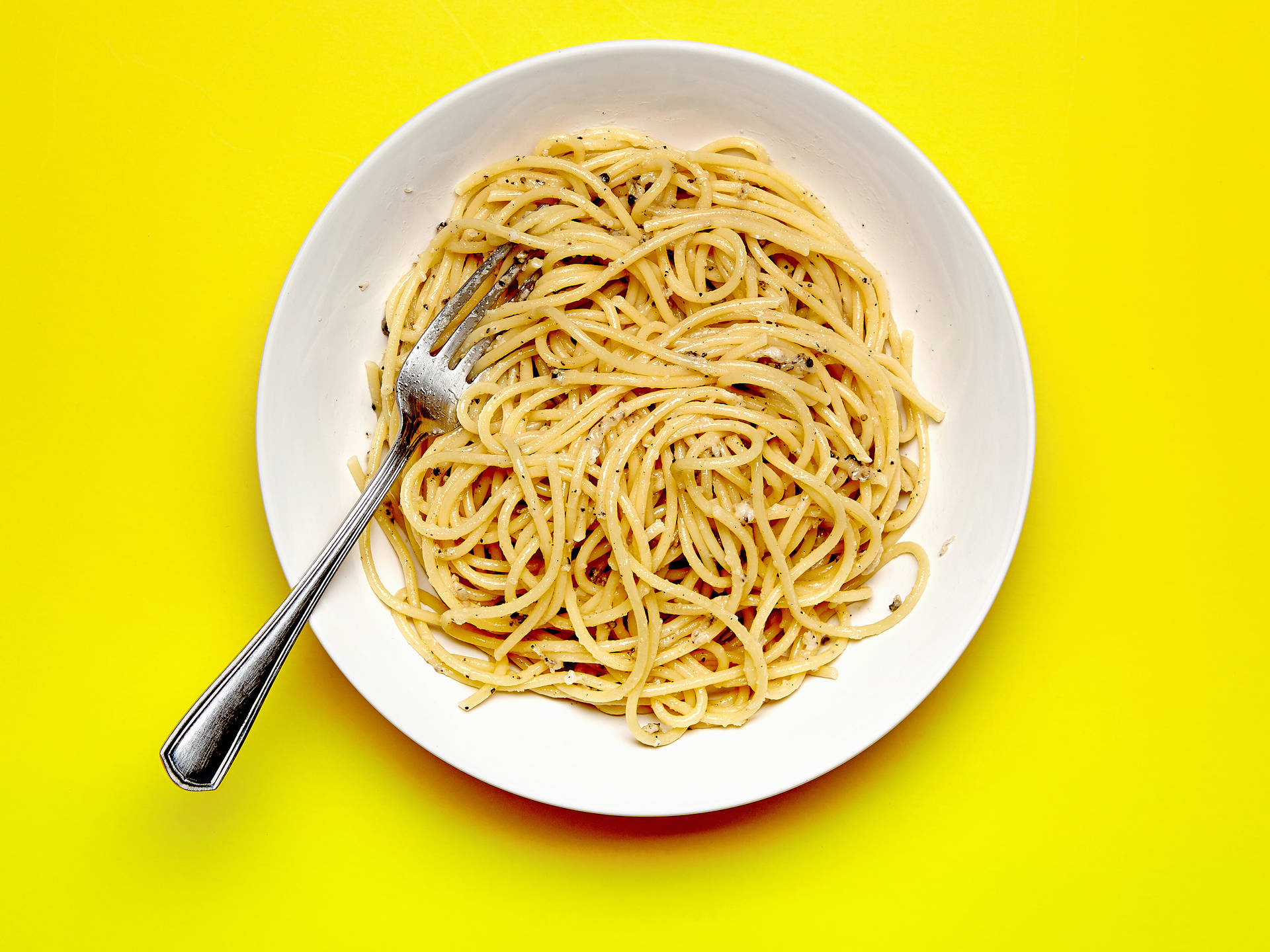 Cacio E Pepe On Yellow Surface