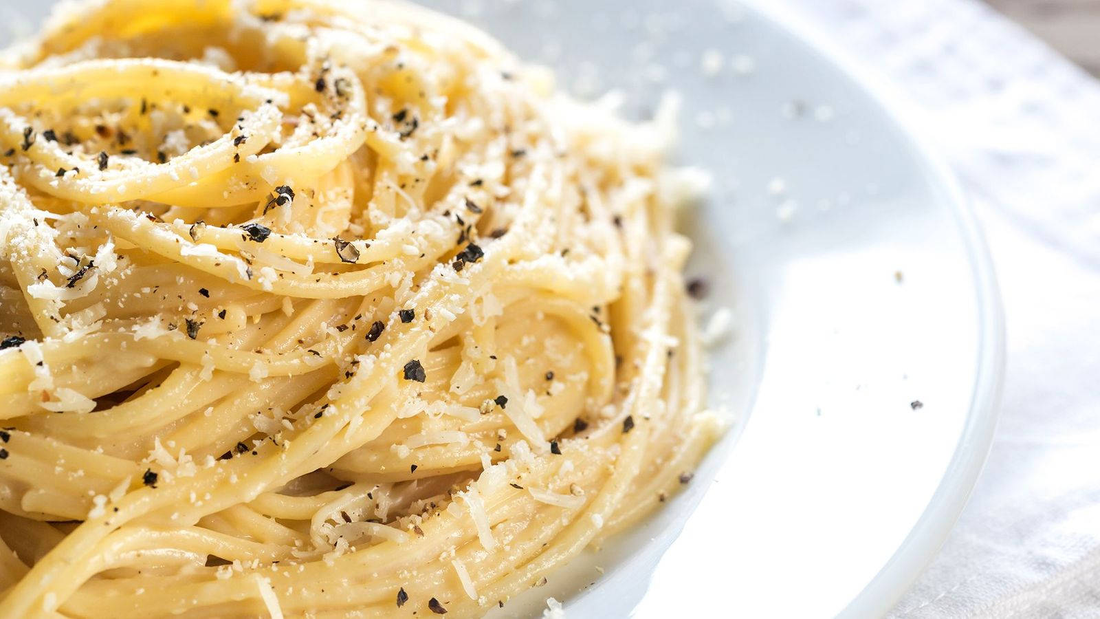 Cacio E Pepe With Fresh Ground Black Pepper Background