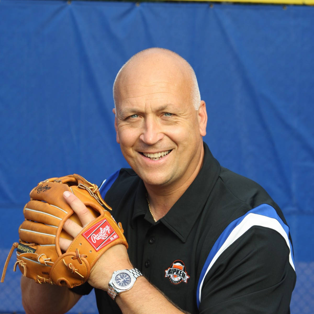 Cal Ripken Jr Posing With Baseball Glove Background