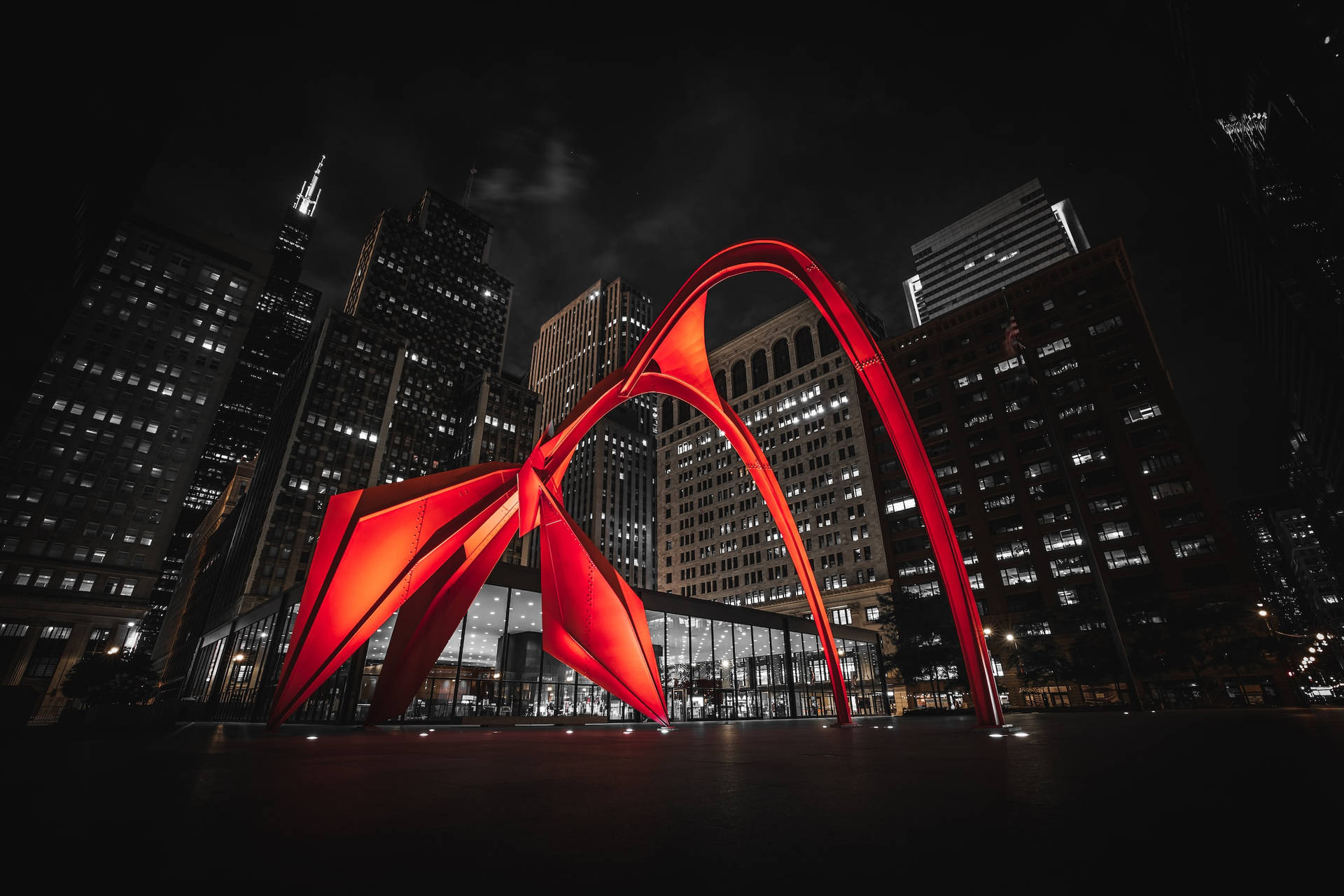 Calder's Flamingo Sculpture Against The Majestic Chicago Skyline Background