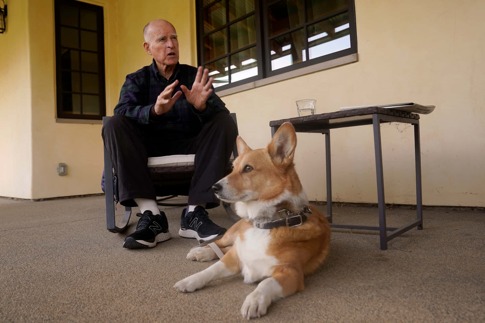 California Governor Jerry Brown Cuddles With Dog Background