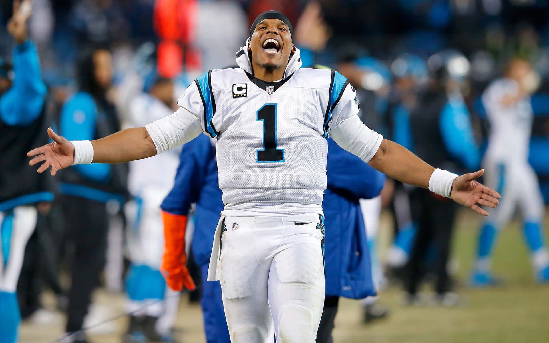 Cam Newton With A Large Smile On His Face During A Carolina Panthers Game Background