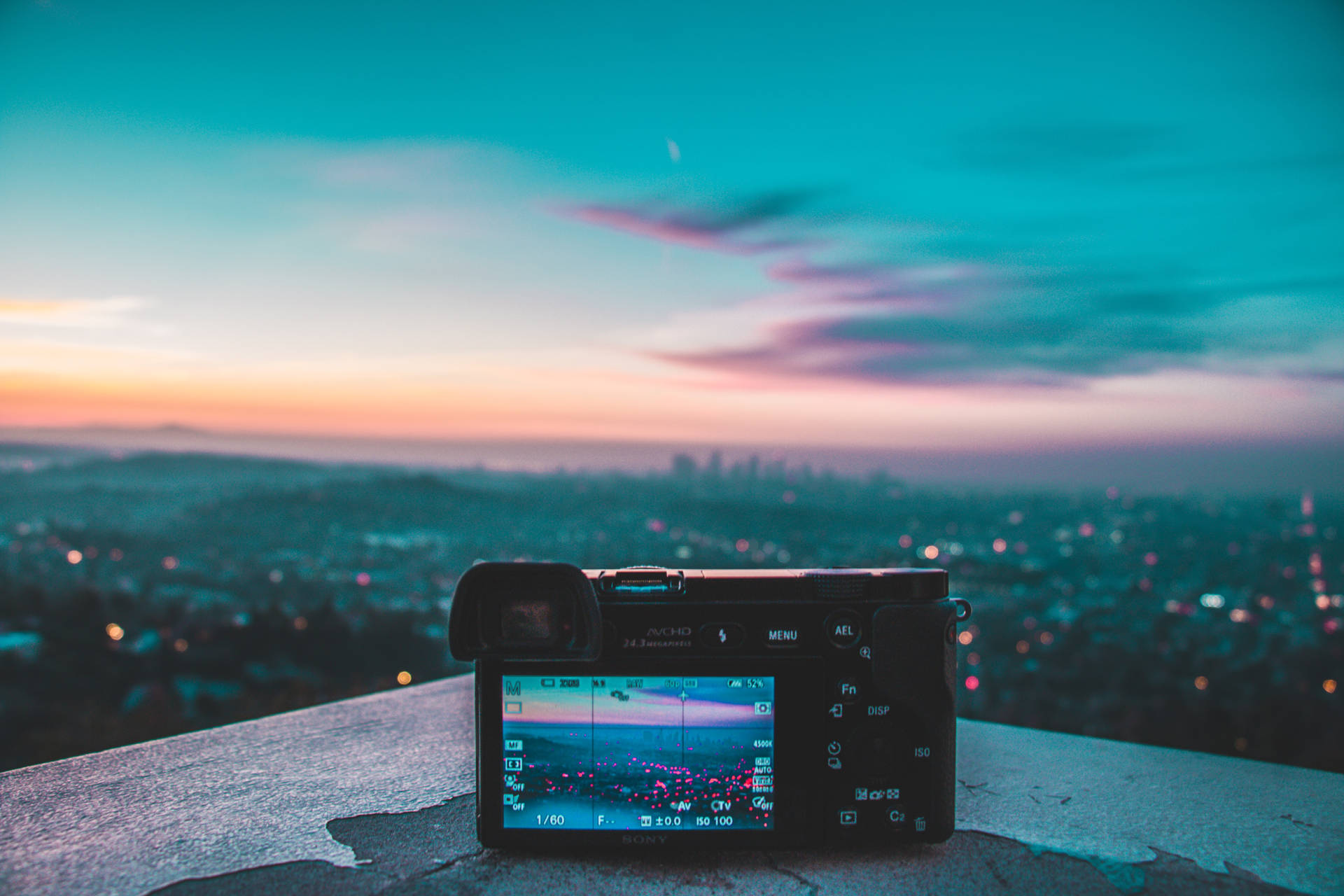 Camera Capturing City Lights Background