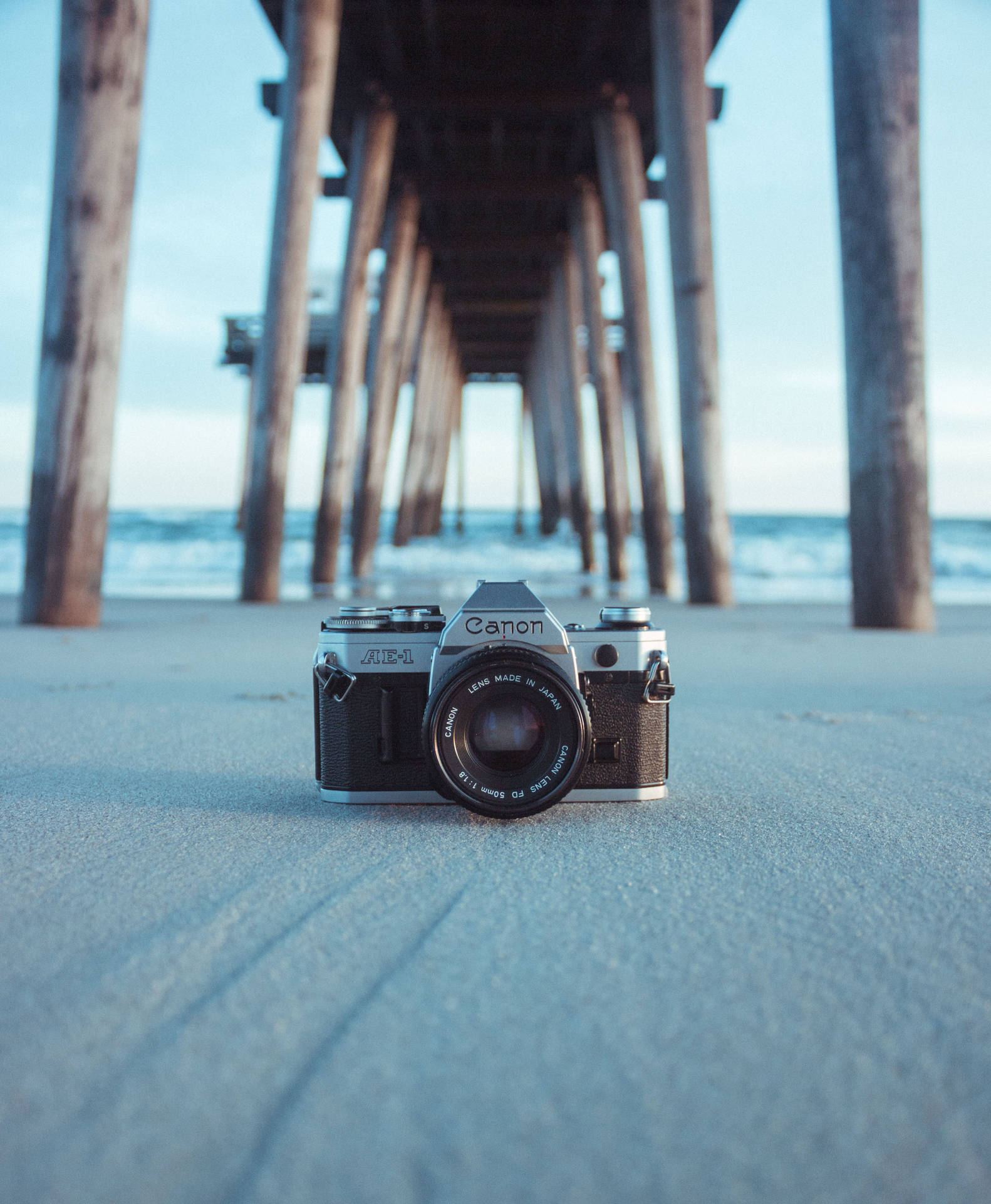 Camera In The White Sand Background