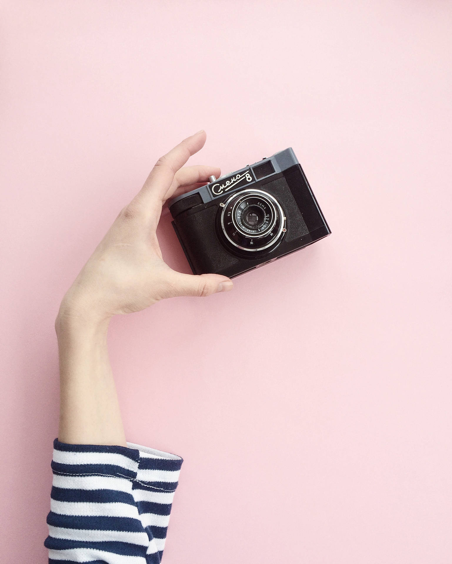 Camera On A Pink Background Background