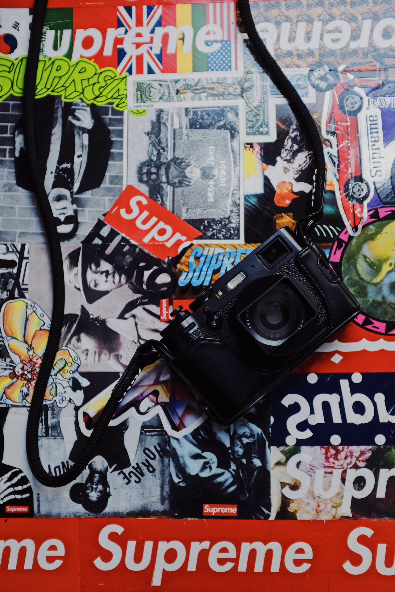 Camera On Superior Supreme Logo Collage Background