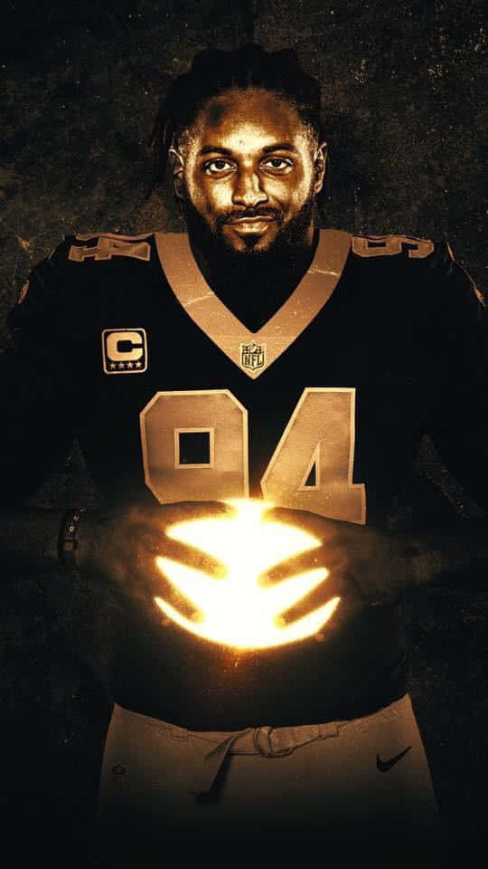 Cameron Jordan Holding Football Background