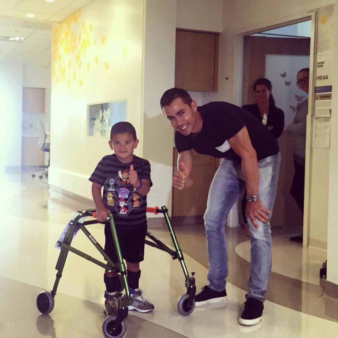 Camilo Villegas And Injured Child