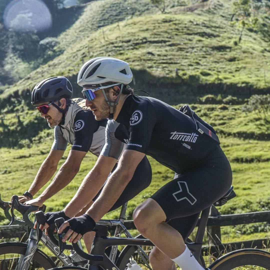 Camilo Villegas Cycling With Friend Background