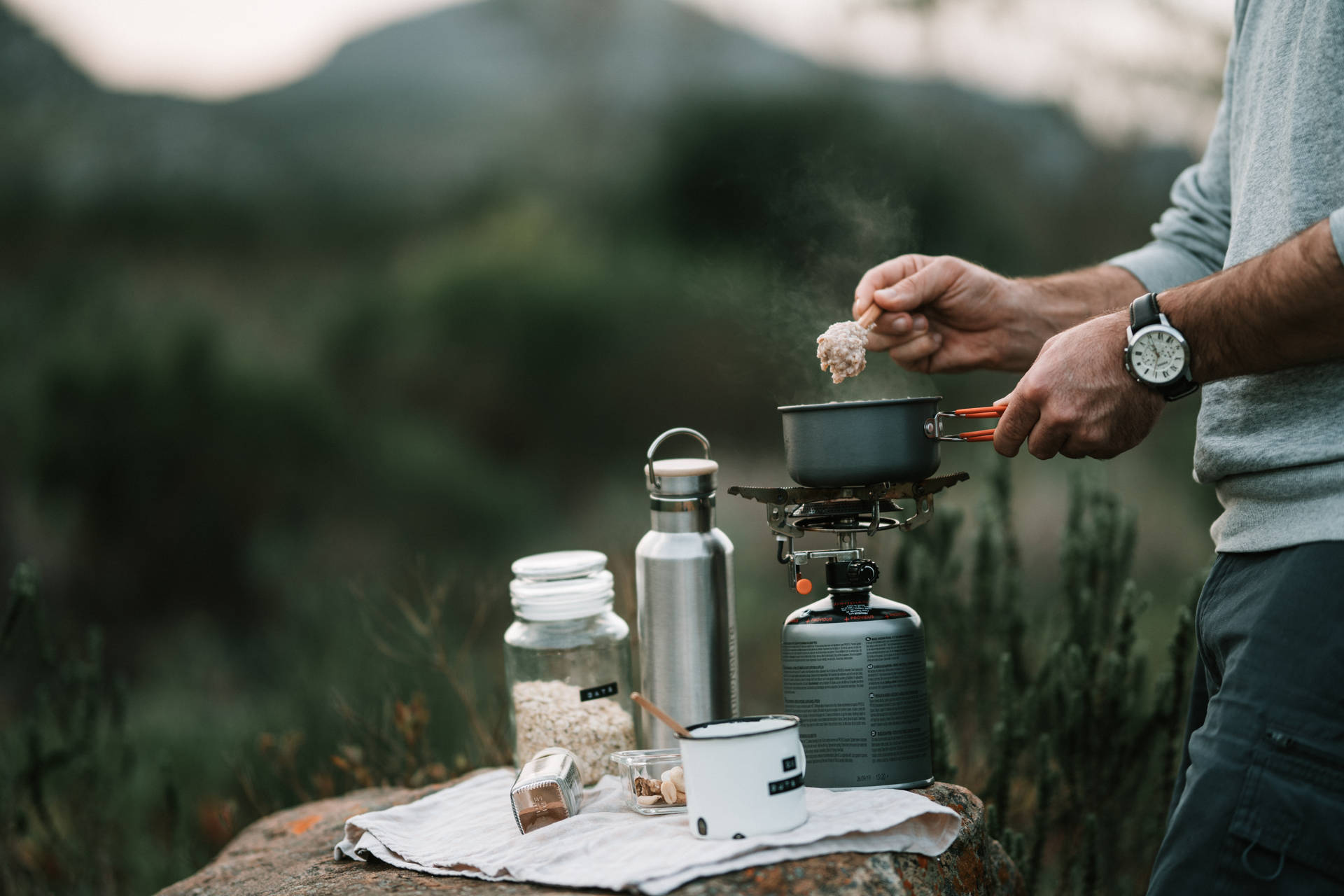 Camper Preparing Oatmeal Background