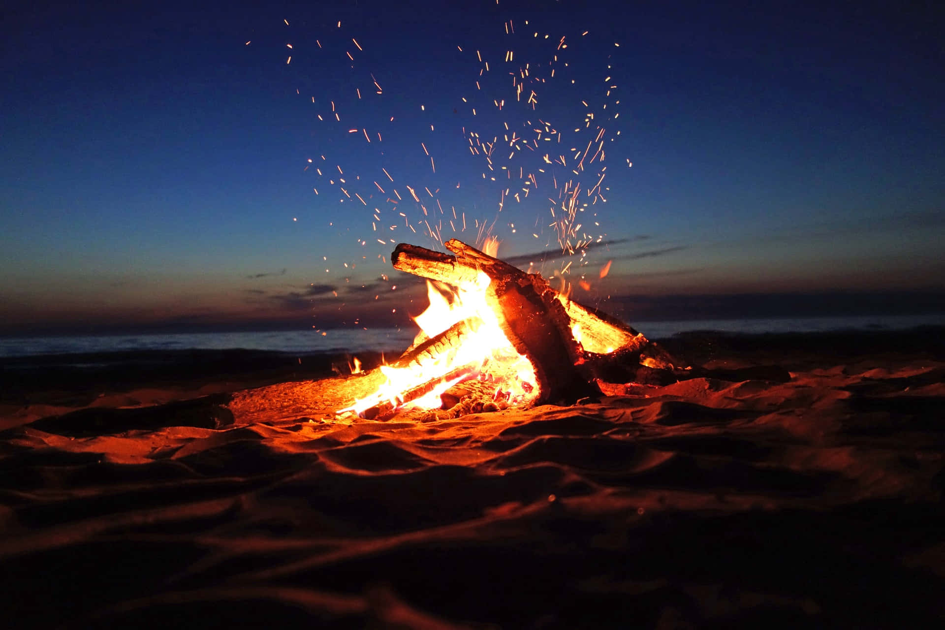 Campfire By The Beach Background