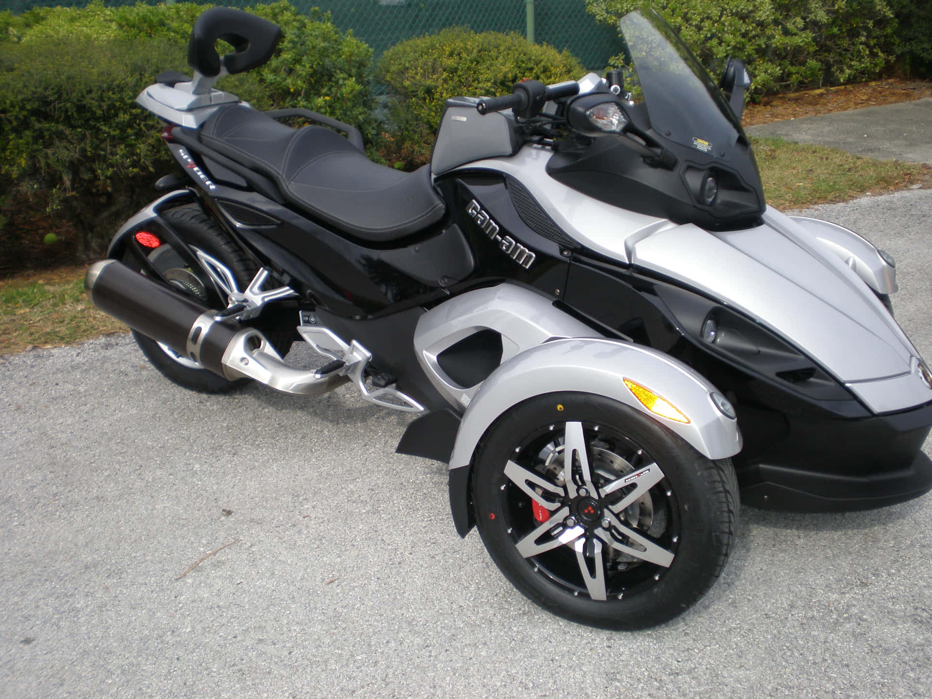 Can Am Spyder Motorcycle Parked Outdoors Background
