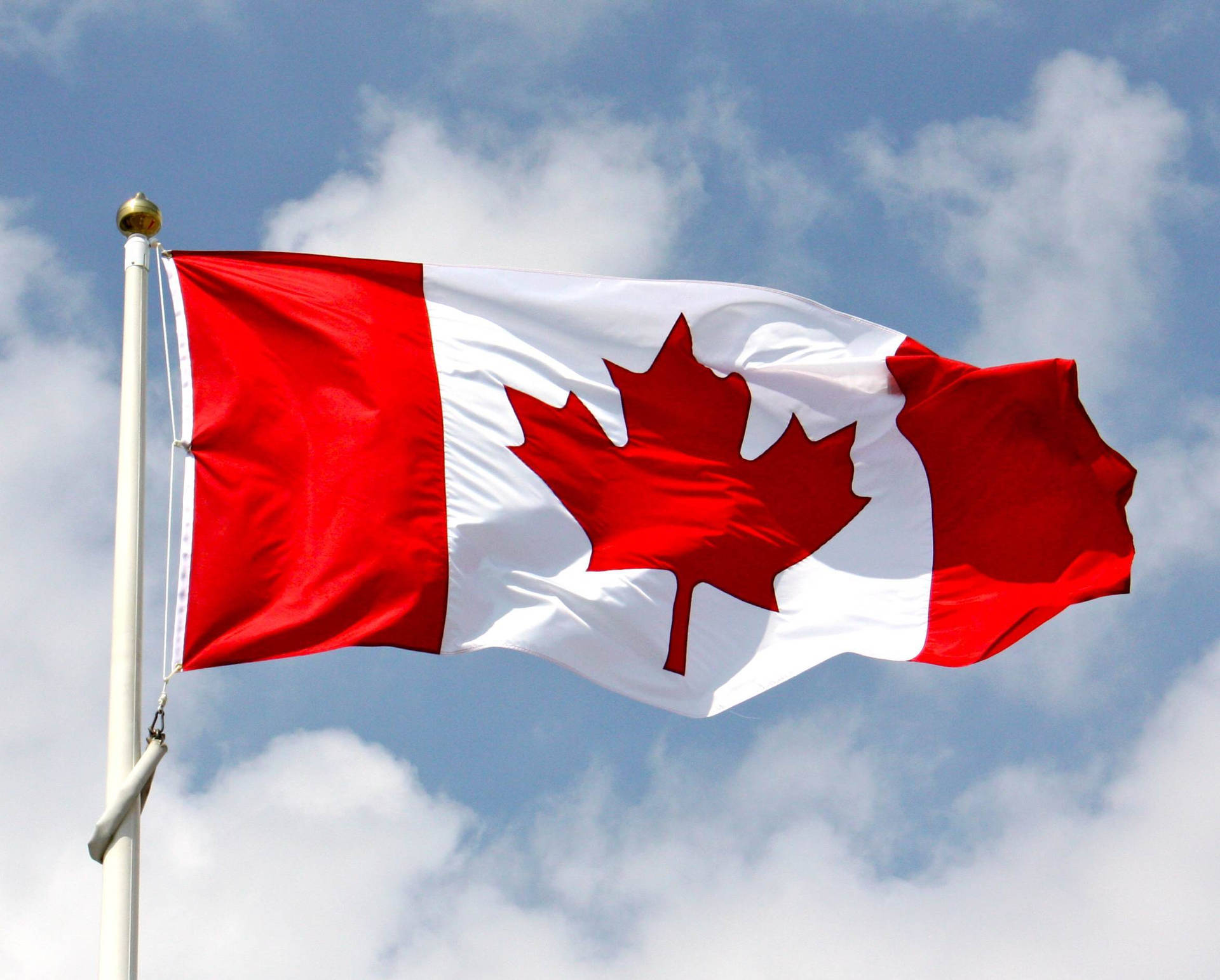 Canada Flag And Clouds Background