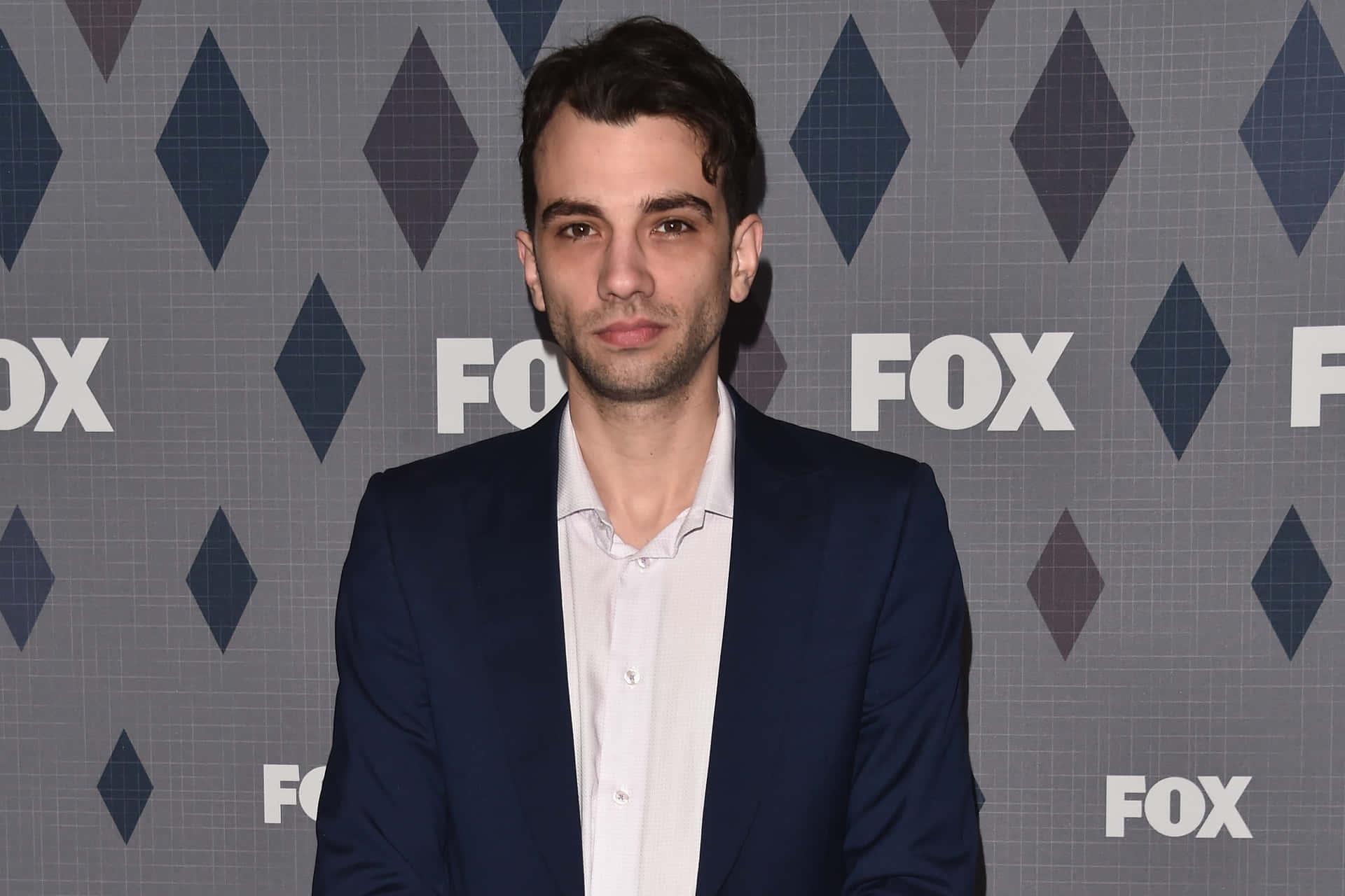 Canadian Actor Jay Baruchel In A Contemplative Pose Background