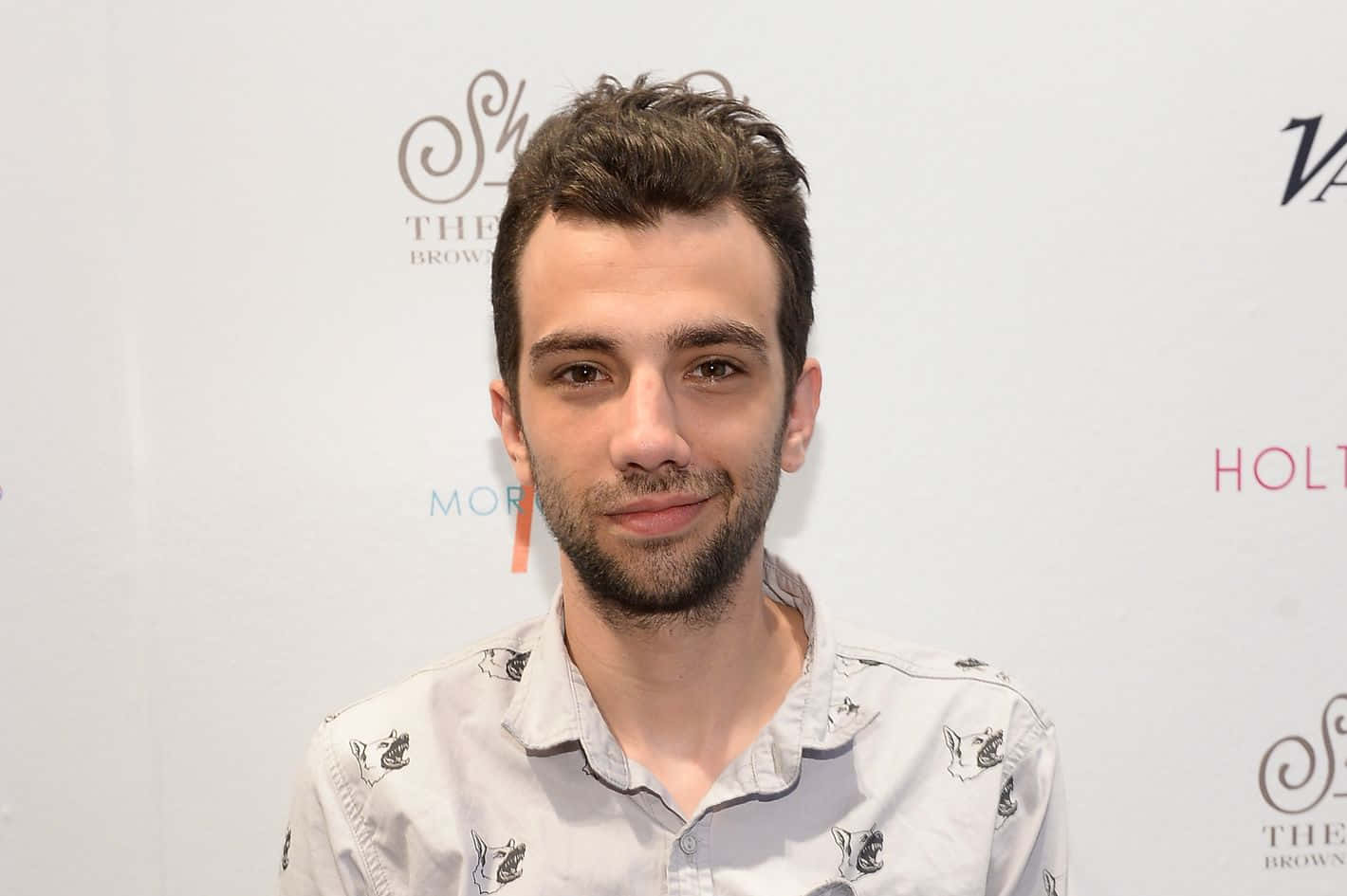 Canadian Actor Jay Baruchel Posing At An Event Background