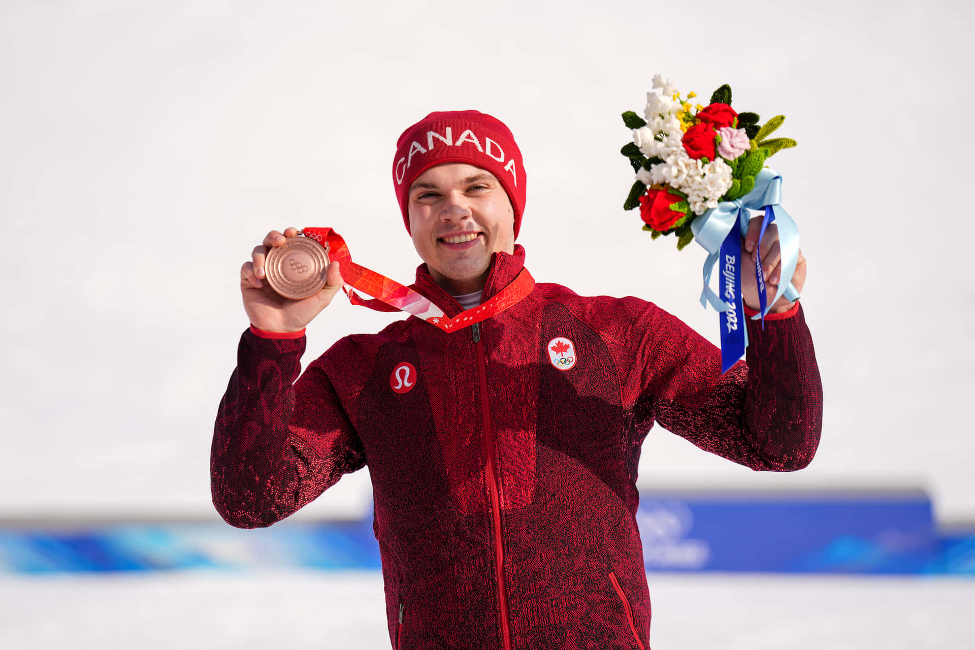 Canadian Athlete Celebrates Bronze Medal Win Background