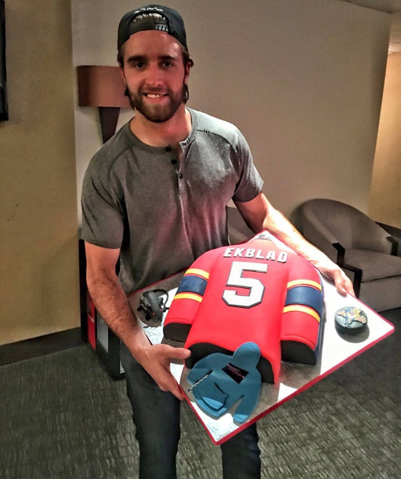 Canadian Ice Hockey Player Aaron Ekblad Holding Cake Portrait Background