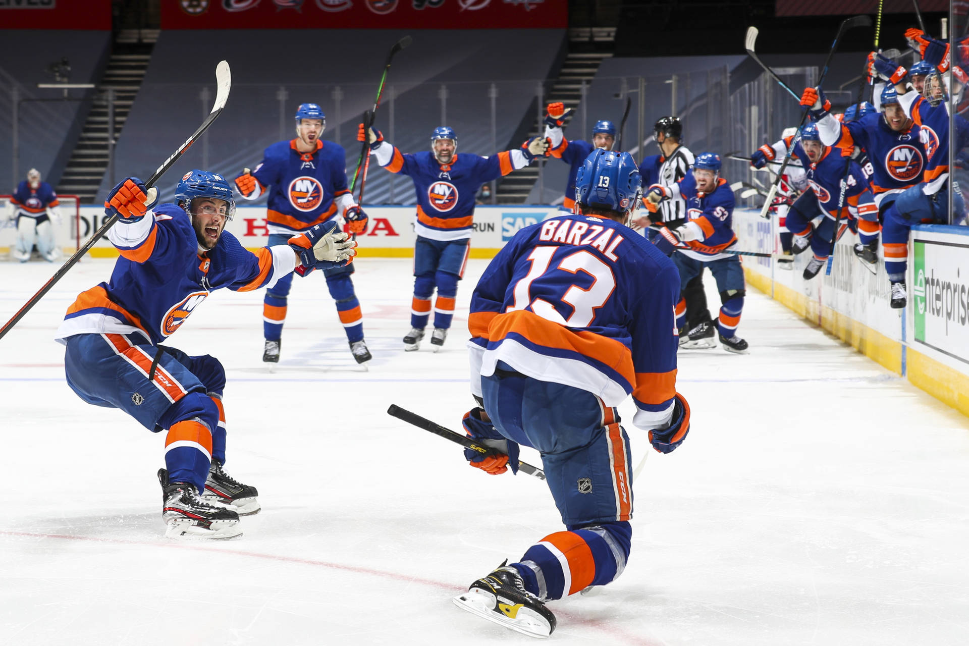 Canadian Ice Hockey Player Mathew Barzal Celebrating With Teammates Background