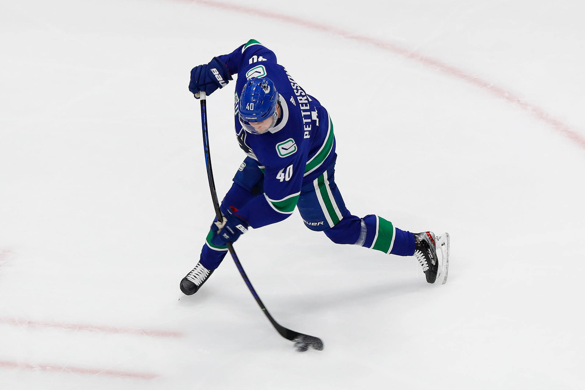 Canadian Nhl Player Elias Pettersson In Blue Jersey