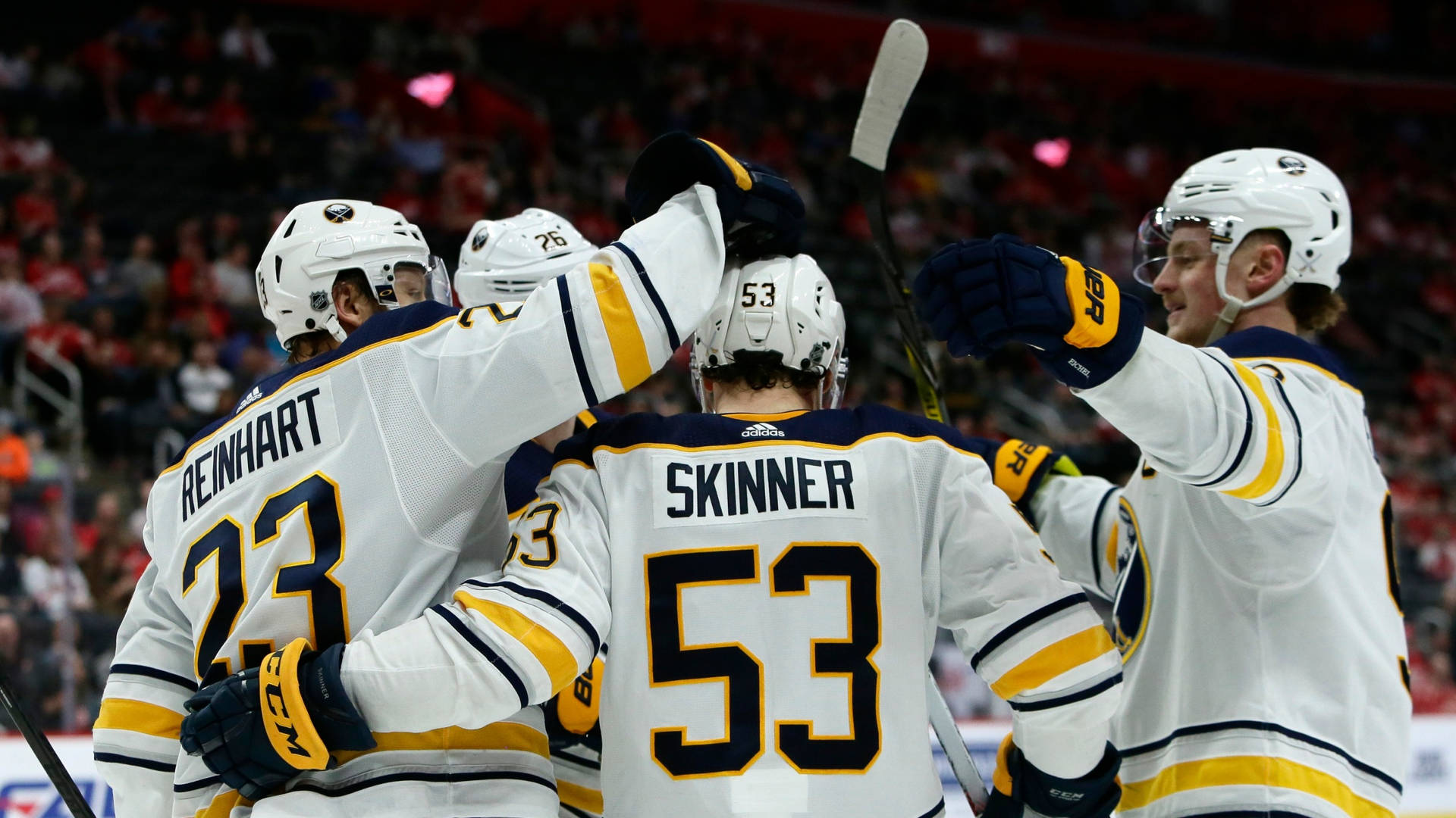 Canadian Nhl Player Jeff Skinner With Buffalo Sabres Teammates Background